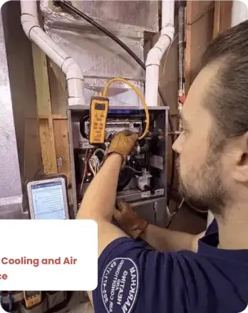 Markham Heating technician servicing a furnace